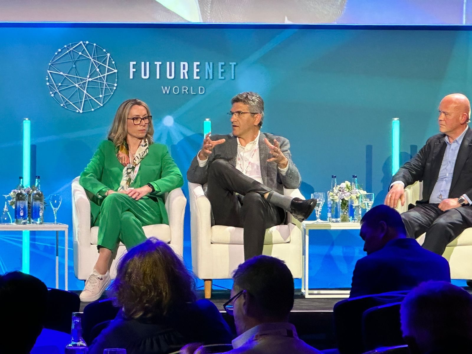 Dr. Petrit Nahi speaking on a telecom panel